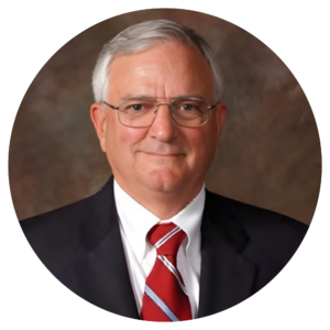 A professional headshot of a man. The man depicted is Bobyy Lewis, the tournament chair. 